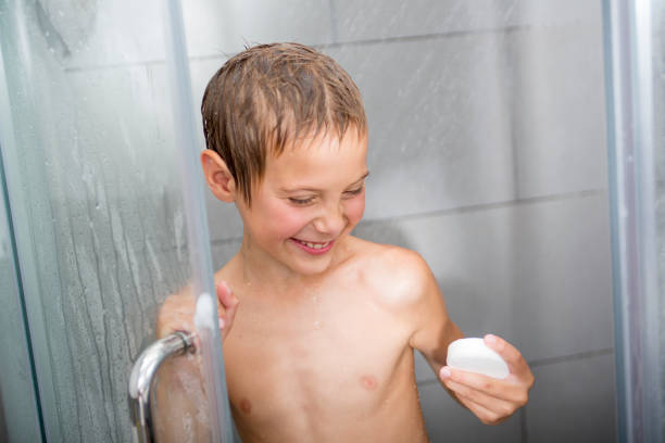 Child Bathing in a Bathtub