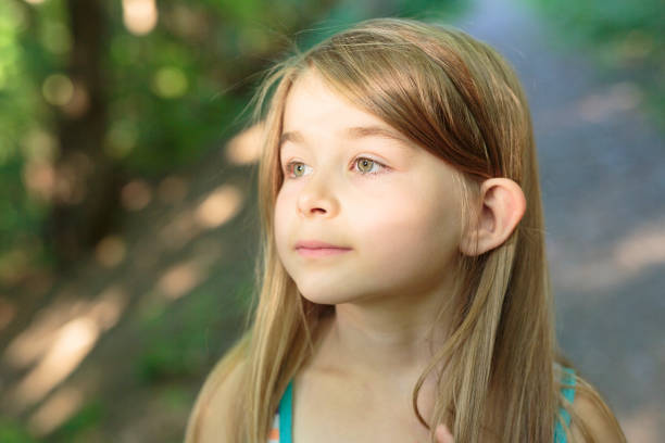 istock child girl on green forest 854264650