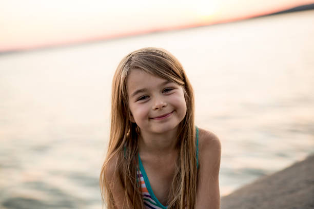 istock Portrait girl in sunset sky 854265224