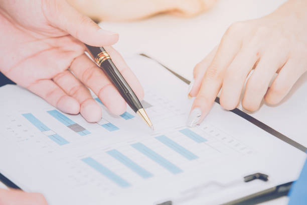 istock chart document  on background of male and female hands 854265796