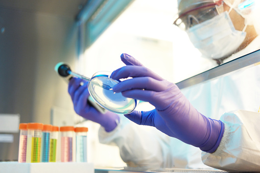 Scientist in clean room laboratory