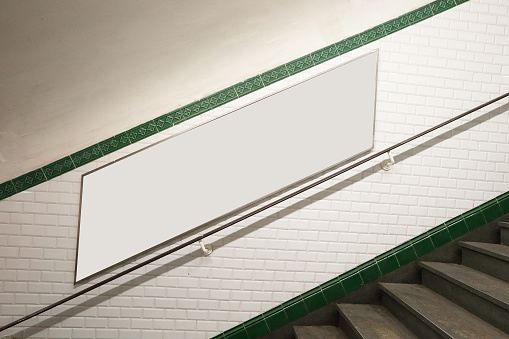 Paris metro staircase with billboard for your copy space