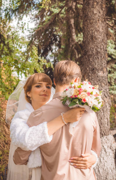 istock Young happy newlyweds in autumn park 854273132