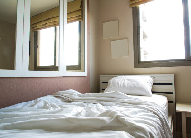 istock The white and clean blanket crumpled on bed 854273546
