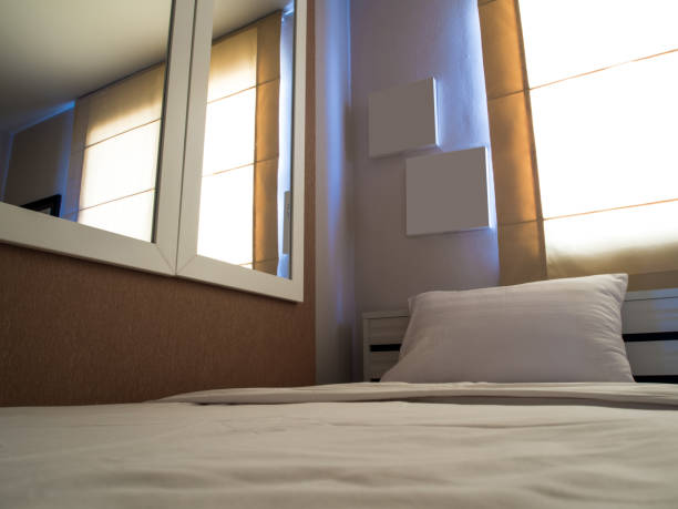 istock White blanket and pillow on bed in bedroom 854273554