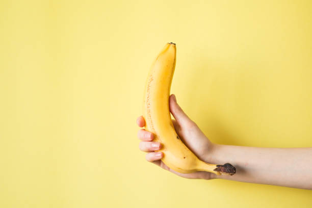 istock Human Hand Holding Banana Fruit Nutrition Concept 854288318
