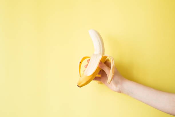 istock Human Hand Holding Banana Fruit Nutrition Concept 854288356