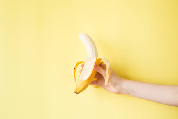 istock Human Hand Holding Banana Fruit Nutrition Concept 854288388