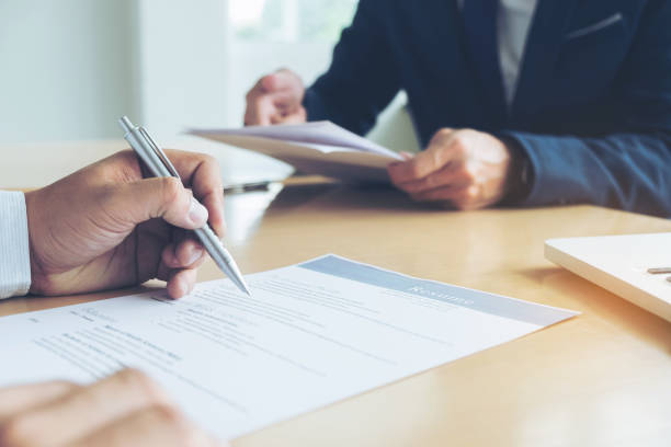 istock Executive reading a resume during a job interview and businessman Completing Application Form. Hiring concept 854288920