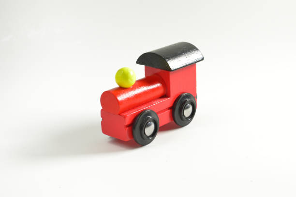istock Wooden toy train with colorful blocs isolated on white background 854292346