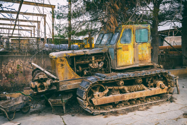 istock Abandoned bulldozer on old abandoned plant 854295888