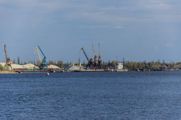 Cranes in cargo port on river Dnieper in Kremenchug, Ukraine