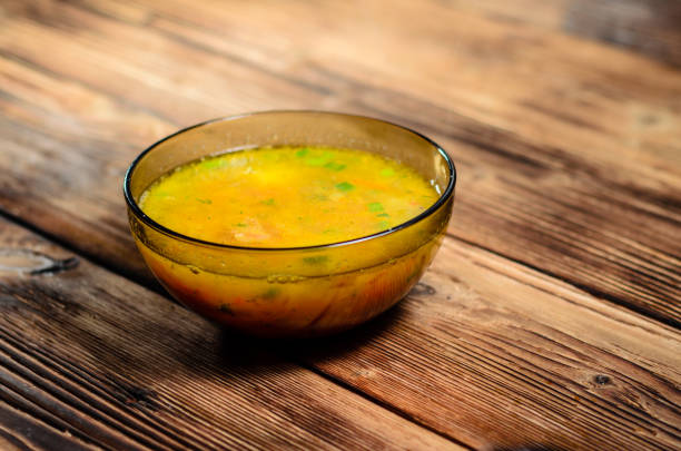 istock Vegetable soup in a glass bowl on wooden table 854296094