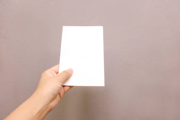 istock A hand holding a paper card 854296144