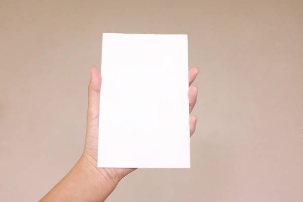 istock A hand holding a paper card 854296156