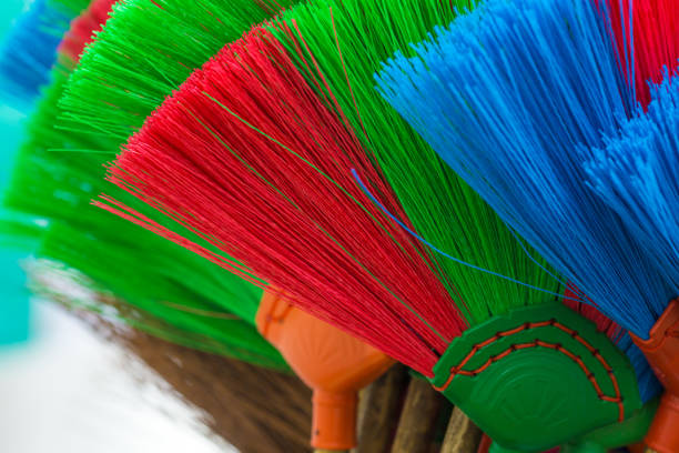 The colorful and patterns of plastic brooms.Soft focus