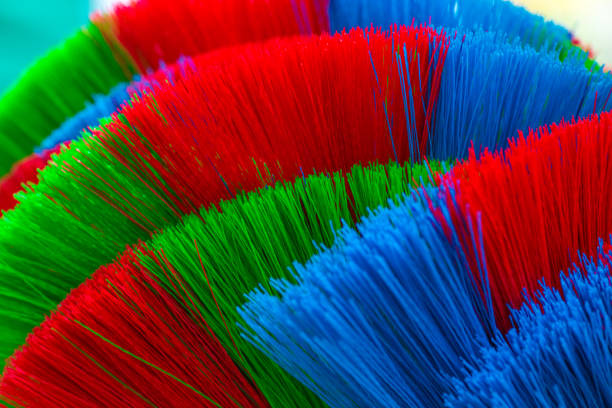 istock The colorful and patterns of plastic brooms. 854297232