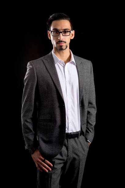 istock Dark-Haired Bearded Young Man in Full Gray Business Attire 854300608