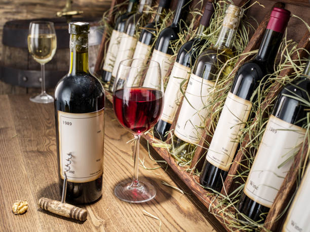 istock Glass of wine and wine bottle. Wine testing at the storage. 854301114