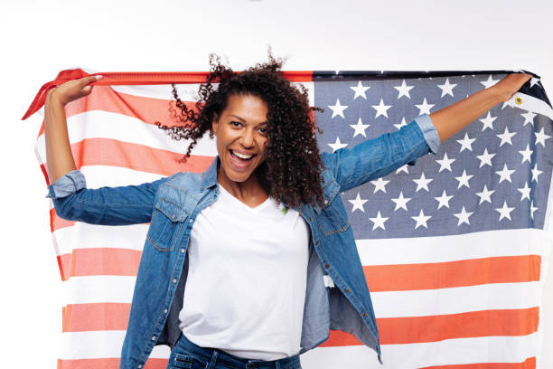 istock Cheerful woman posing with an American flag 854303956