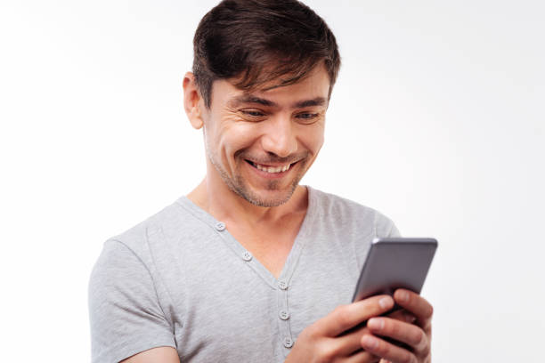 istock Happy handsome man reading text message with smile 854305160