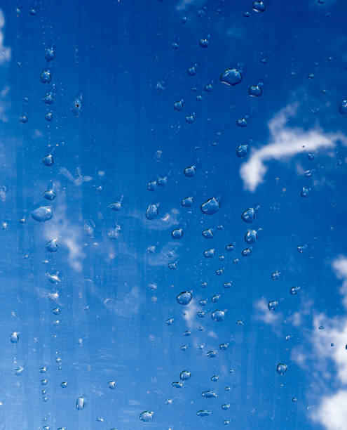 istock drops on the glass under the sky. texture, background. 854305810