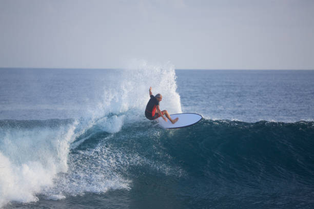 istock Senior surfer off the top of the wave 854312966