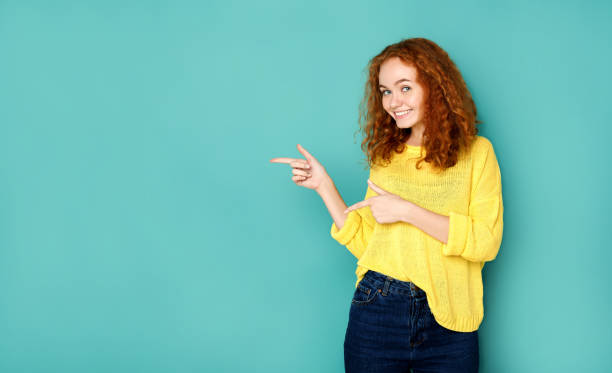 istock Young beautiful woman with peace gesture portrait 854315622