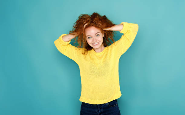 istock Cheerful girl in casual clothes posing at studio 854315920