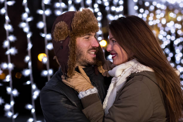 istock Couple hugging outdoors in winter at ice rink 854317058