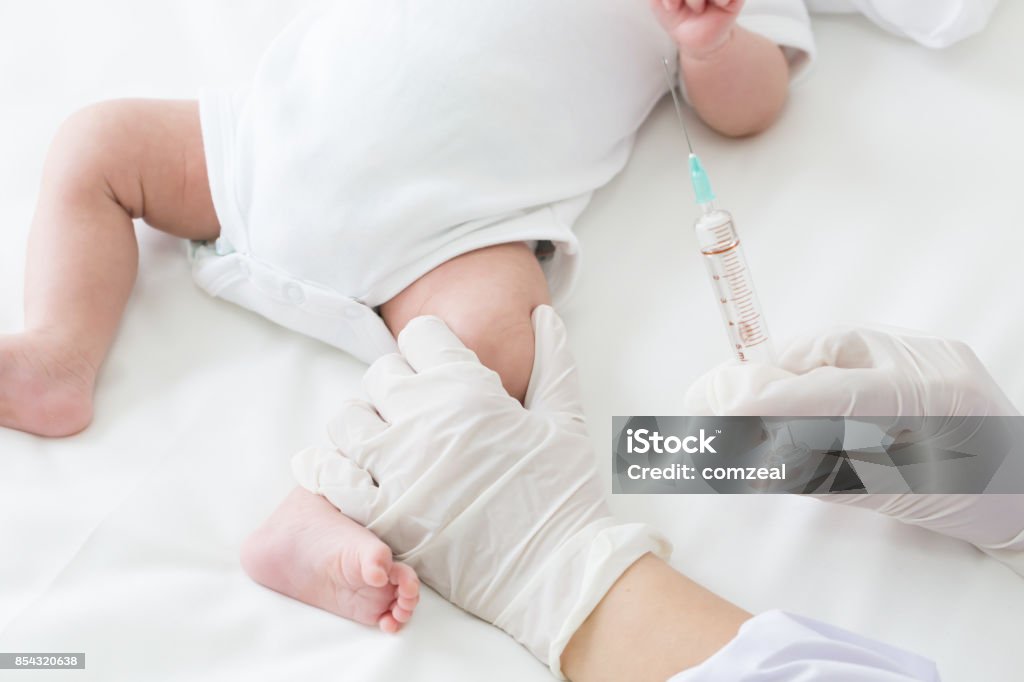 Vaccine, Vaccination Hepatitis B virus for child baby. Doctors vaccinate the thighs of children Baby - Human Age Stock Photo
