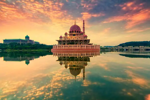 Photo of Beautiful sunrise over Putrajaya with soft focus reflection due to long exposure technique