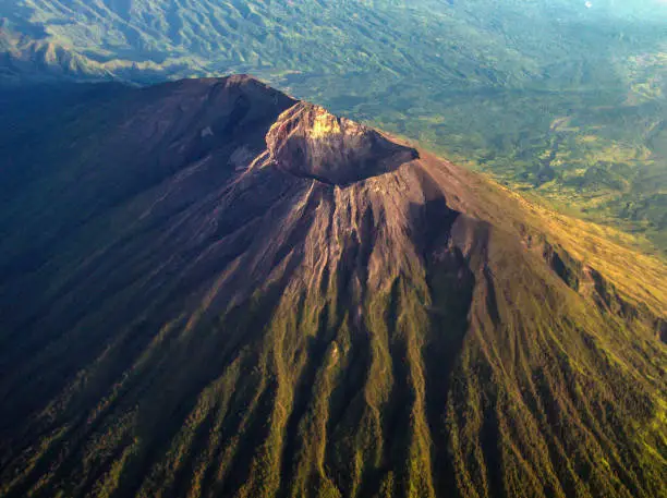 Mount Agung - Bali taken from Garuda Indonesia airplane window, flight Denpasar to Makassar just a moment after the sunrise.