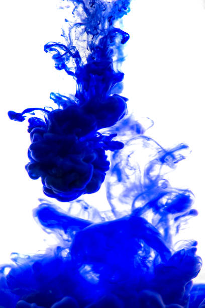 istock blue ink in water isolated on white background 854322298