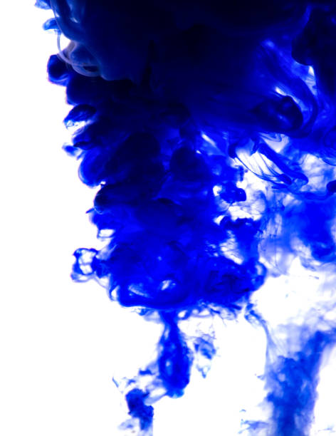 istock blue ink in water isolated on white background 854322576