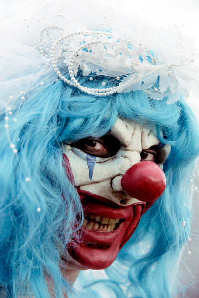 istock scary evil clown in a bride dress 854325796
