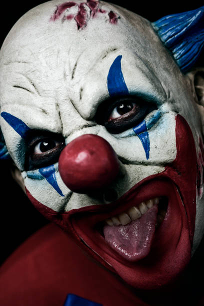 istock scary evil clown taking out his tongue 854326006