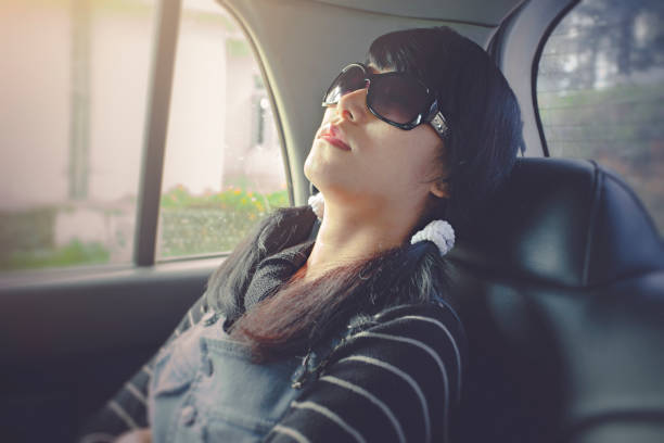 istock Young woman sitting in car and relaxing. 854326676