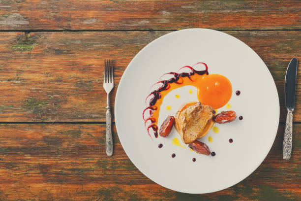 istock Roasted goose liver with date fruit and apple 854326874