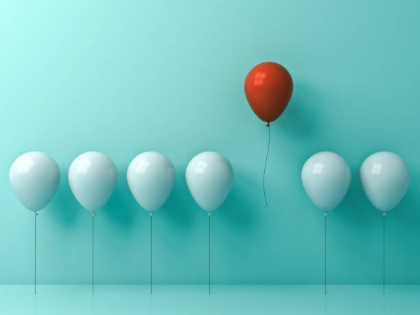 istock Stand out from the crowd and different concept , One red balloon flying away from other white balloons on light green pastel color wall background with window reflections and shadows . 3D rendering 854329262