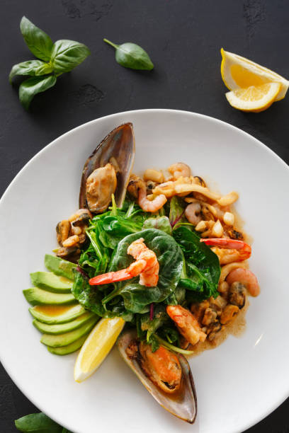 istock Warm salad with grilled seafood flat lay 854335932