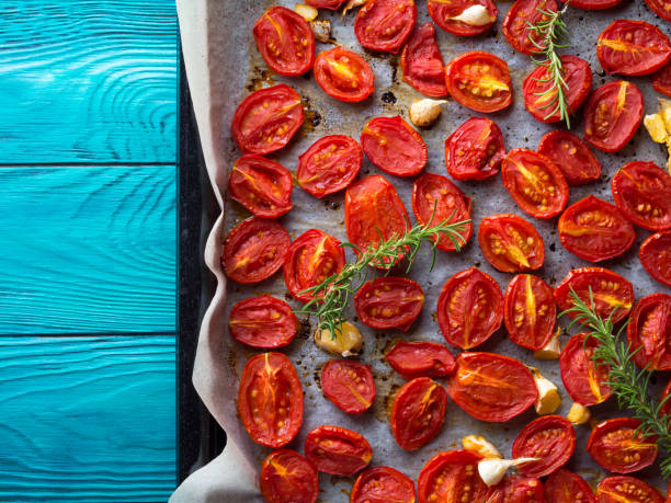 istock Red heirloom tomatoes baked with garlic 854336354