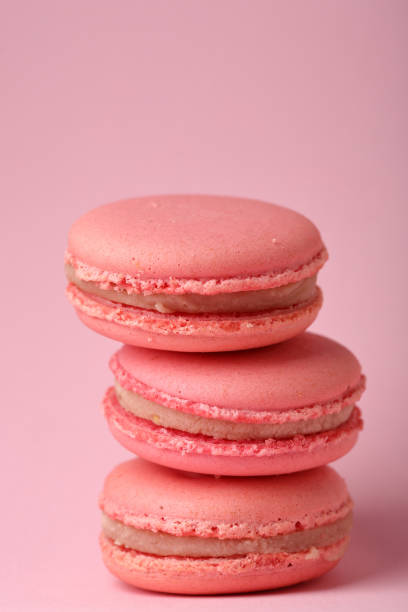 istock Pink cookies macaroons, food closeup 854340184