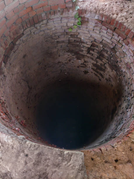 inside of a dry well made of bricks.