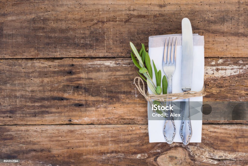 Rustic cutlery place setting Table place setting with old silverware and wooden table. Place Setting Stock Photo