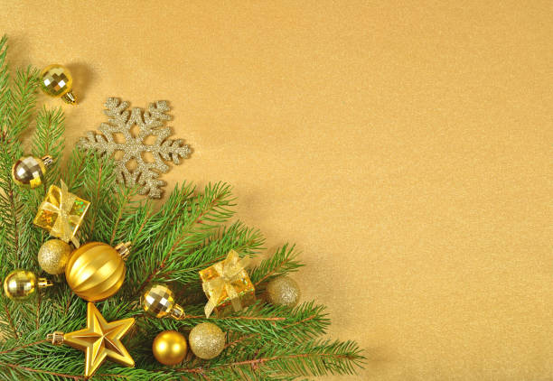 istock Golden Christmas decorations on a spruce branch 854345784