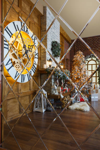istock Cozy christmas interior with fir tree and fireplace reflecting in mirror 854352904