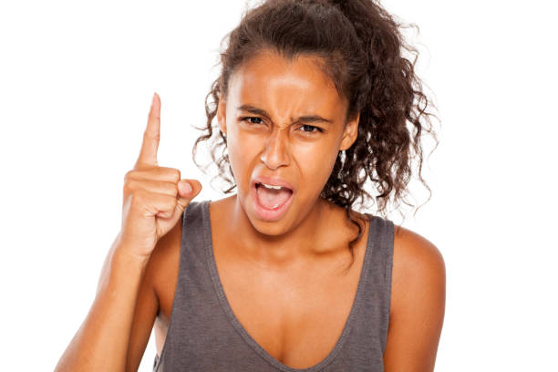 istock Nervous and angry dark skinned young girl on white background 854359158