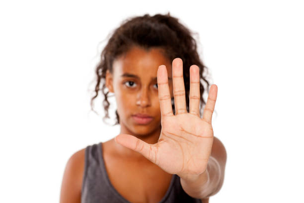 istock sad african girl shows a stop hand 854359166