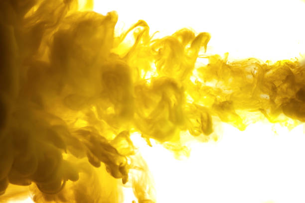 istock yellow ink in water isolated on white background 854363392